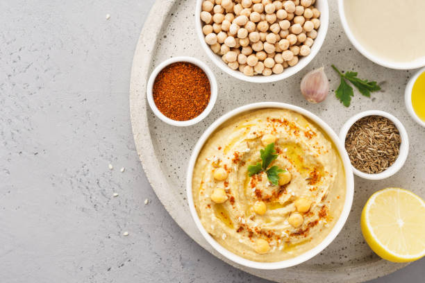 istock Hummus bowl and raw ingredients for cooking. 1132987666