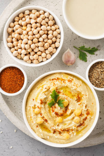 istock Hummus bowl and raw ingredients for cooking. 1132987963