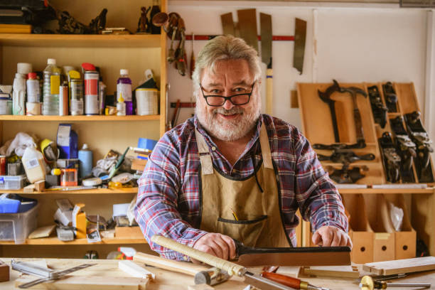 istock Portrait of cheerful mature carpenter 1132989099