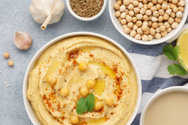 istock Traditional hummus and ingredients for cooking. Top view. 1132989287