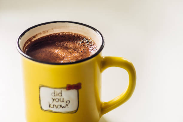 istock Yellow mug with coffee . With an inscription. Did you know? 1132990267