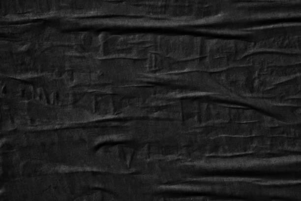 istock Dark black blank paper backgrounds creased crumpled surface old torn ripped posters grunge textures placard 1132990908
