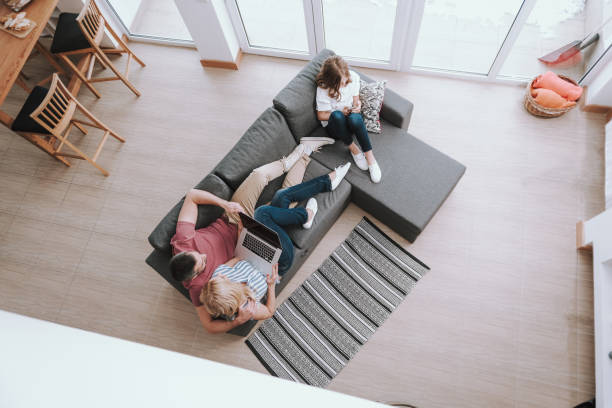 istock Lovely family resting on comfortable couch at home 1132990988