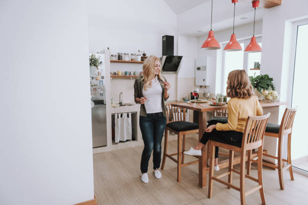 istock Joyful loving mother having dinner with her cute daughter 1132990991