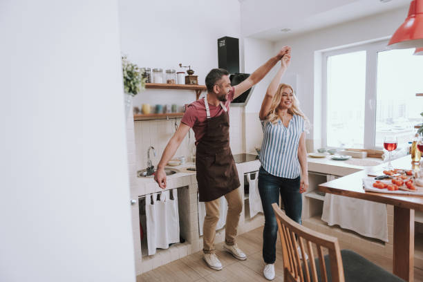 istock Beautiful couple dancing and having fun at home 1132991020