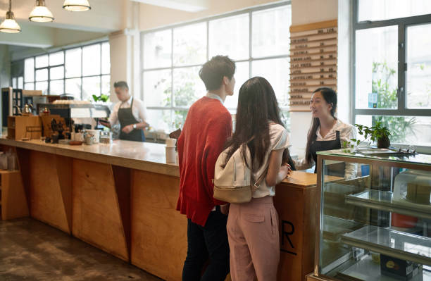 istock Customers talking to barista at cafeteria 1132991746