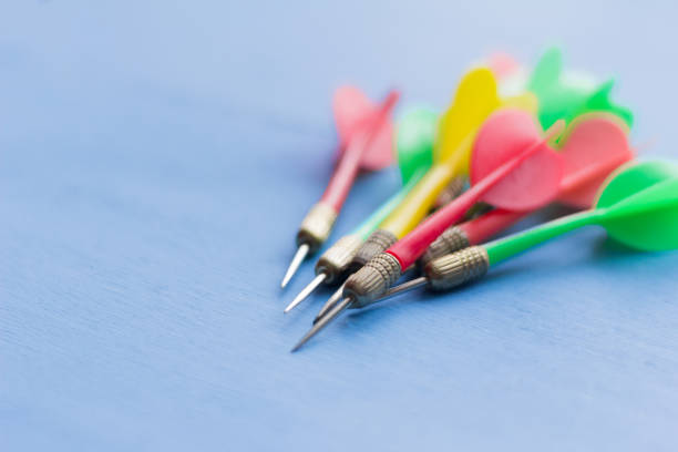istock bunch of Darts on blue wooden background 1132992159
