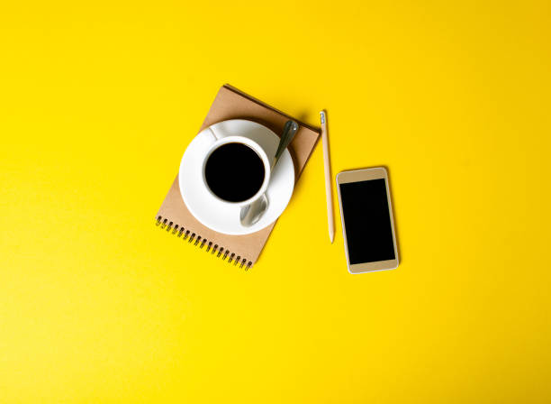 istock Cup of coffee, notepad, pencil, mobile phone 1132993550
