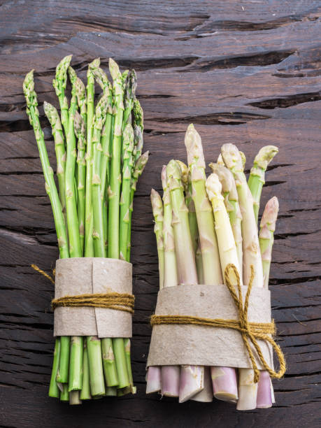 istock Green and white types of asparagus sprouts. 1132994385