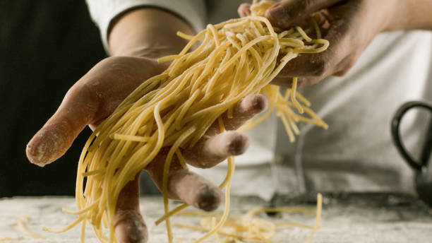 istock Cook holding freshly cooked spaghetti in the kitchen 1132995057