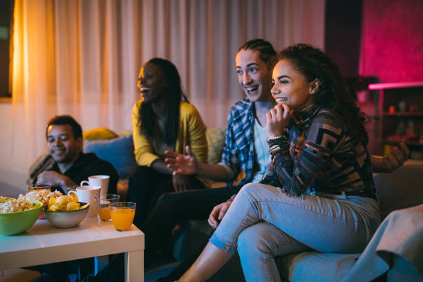 istock Friends watching comedy movie at home 1132997998