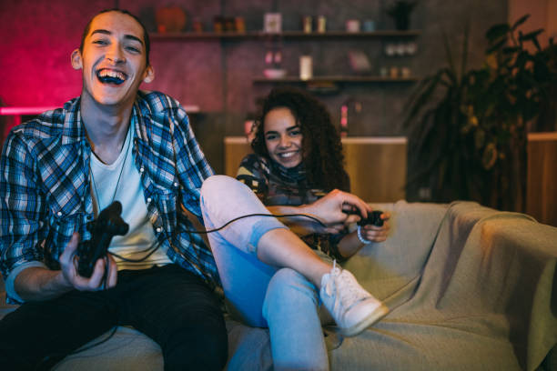 istock Loving Couple having fun while playing video games 1132998117