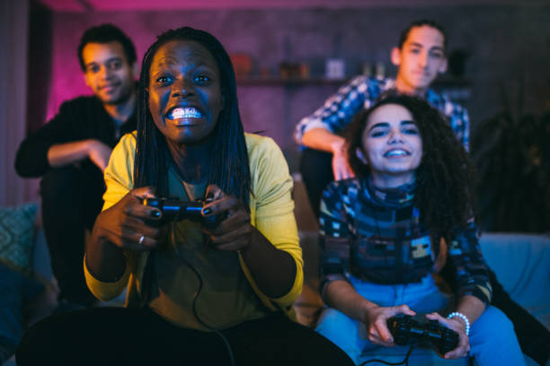 istock Female friends playing video games 1132998248
