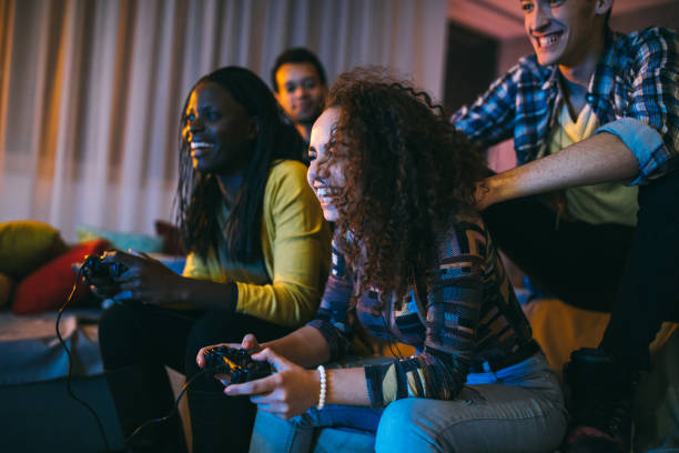 istock Female roommates playing video games 1132998296