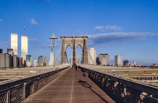 NEW YORK, USA - SEP 10, 1996: brooklyn bridge in New York with twin towers in background.