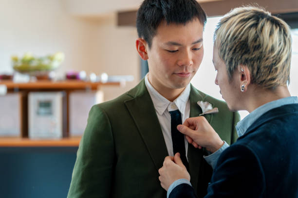 istock Young same sex couple getting ready to go out on a date 1132999377