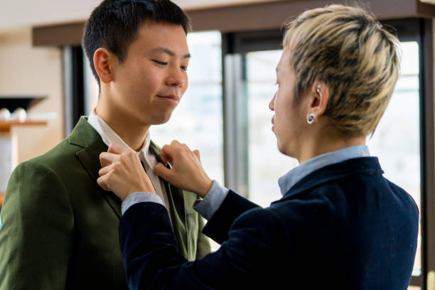 istock Young same sex couple getting ready to go out on a date 1132999398
