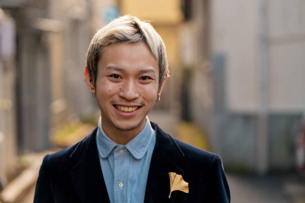 Portrait of a young male adult Portrait of a young male adult. Tokyo, Japan queer man facing camera stock pictures, royalty-free photos & images