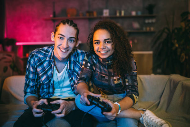 istock Loving Couple having fun while playing video games 1132999643