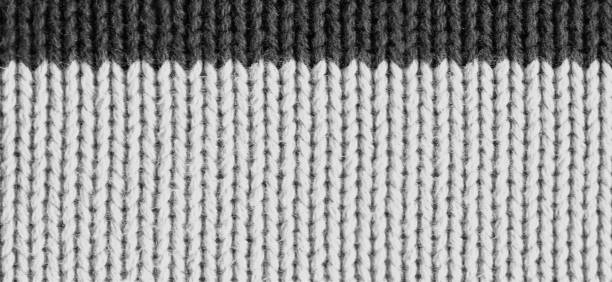 istock Texture of knitted wool fabric, woolen cloth, striped warm knitting sweater. 1132999862