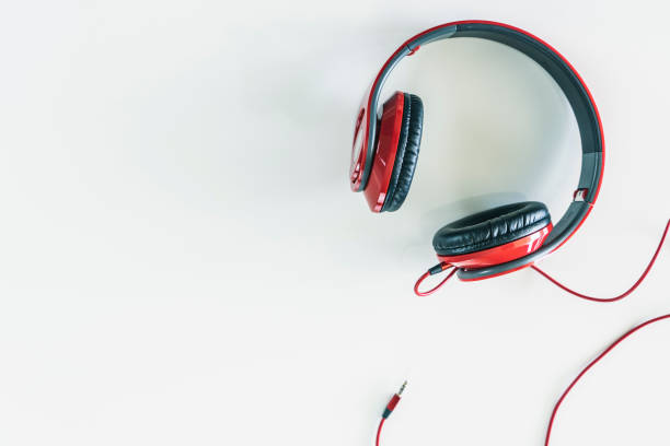 istock red headphones on white background with a jack 1132999893