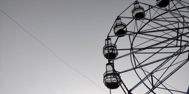 istock Amusement park with giant Ferris wheel 1132999960
