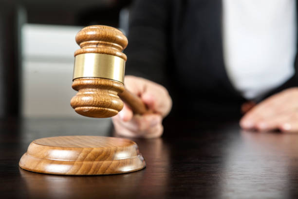 Gavel in woman hand stock photo