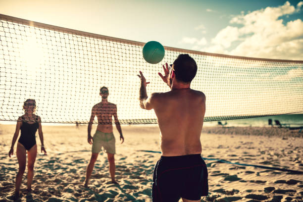 istock Group Of People Playing Beach Volleyball During a Vacation 1133003168