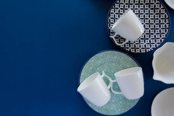 istock Overhead flat lay view of different clean tableware on blue background 1133003273