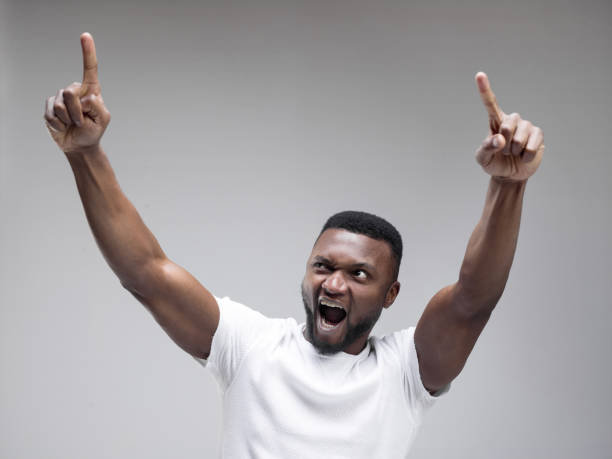 istock Winning success man happy ecstatic celebrating being a winner. Dynamic energetic image of male model 1133004875