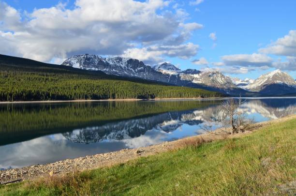 istock A peaceful reflection of mountains covered in snow, reflecting off the lake 1133005449