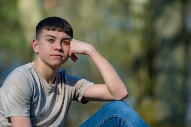 istock Teenage boy outside on a bright Spring day 1133006971