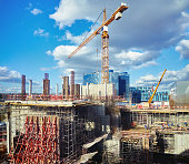 Construction sit,e crane, blue cloudy sky