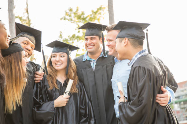 istock College students and friends after graduation ceremony. 1133007216
