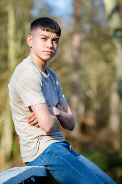 istock Teenage boy outside on a bright Spring day 1133009088