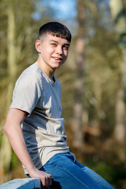 istock Teenage boy outside on a bright Spring day 1133009177