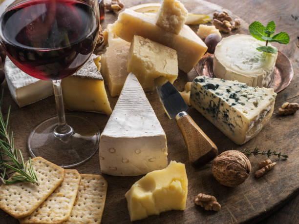 istock Cheese platter with organic cheeses, fruits, nuts and wine. 1133009791