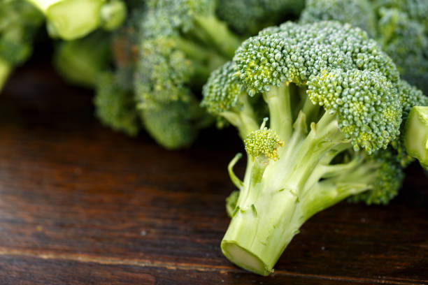 istock Fresh broccoli cabbage on a brown wooden table. 1133011076