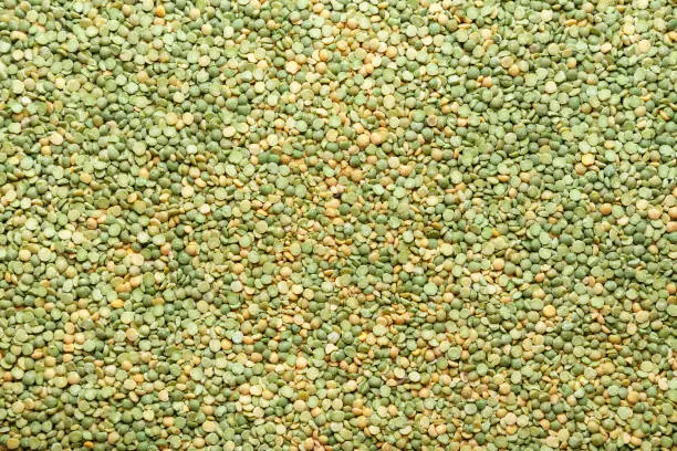 Photo of Background of half dry green peas close-up.