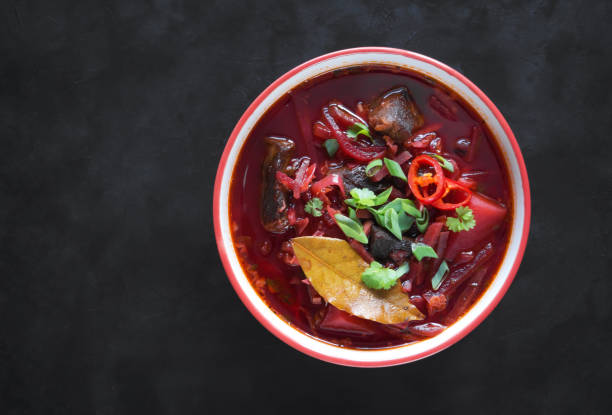 istock Bowl of beet soup with meat on a black background 1133012312