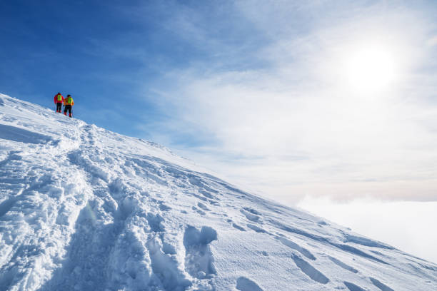istock Tourists on their way to  the snow-covered mountain top. 1133012702