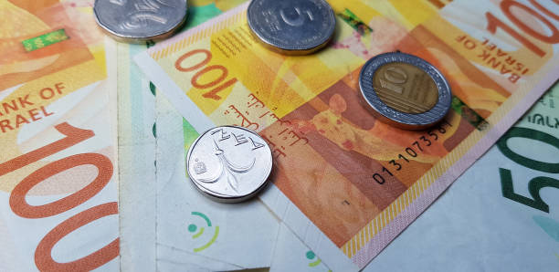 istock Israeli money stack of new shekels banknotes and coins 1133014532