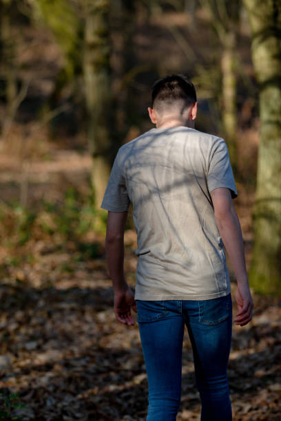 istock Teenage boy outside on a bright Spring day 1133015492