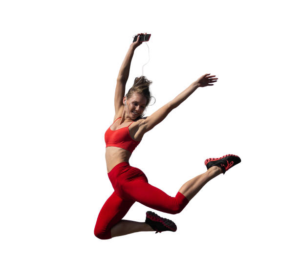 Smiling happy teen girl running mid-air