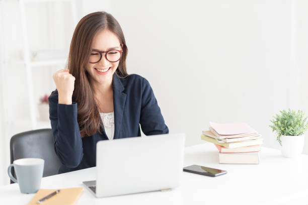 istock Woman is celebrating with raised hand up 1133017205