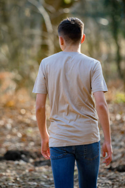 istock Teenage boy outside on a bright Spring day 1133019931