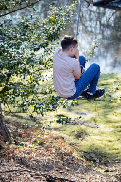 istock Teenage boy outside on a bright Spring day 1133024146