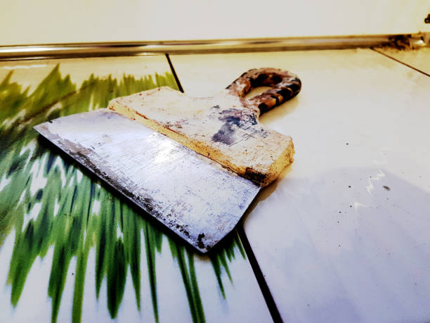 istock Repair - a beautiful spatula on the tiled floor 1133025949