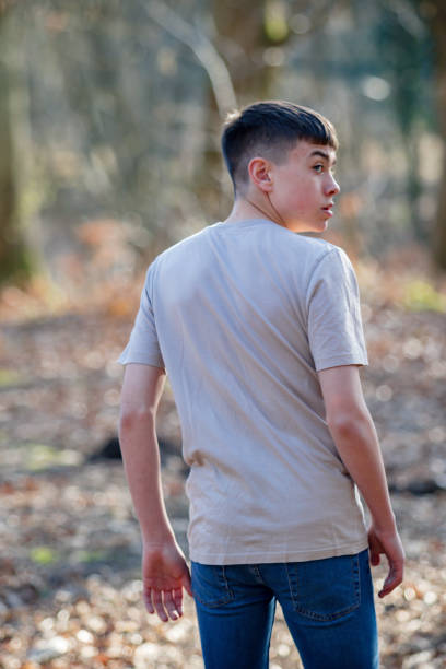 istock Teenage boy outside on a bright Spring day 1133026288
