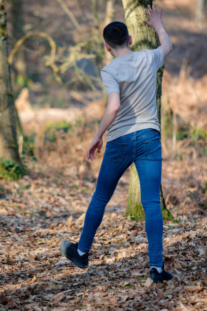 istock Teenage boy outside on a bright Spring day 1133026368